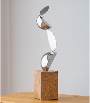 Escultura Movimiento acero y mármol - VP Interiorismo